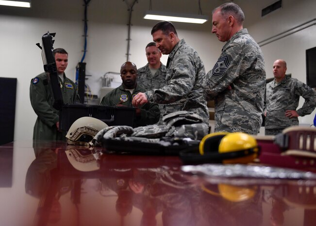 Tech. Sgt. Ray Livingston, 628th Security Forces Squadron phoenix raven, explains to Maj. Gen. Christopher J. Bence, U.S. Air Force Expeditionary Center commander, and Command Chief Master Sgt. Larry C. Williams, U.S. EC command chief, what kind of equipment the Ravens use Dec. 14, 2016. While at JB Charleston, Bence toured Team Charleston's facilities to get a first-hand look at joint operations. 