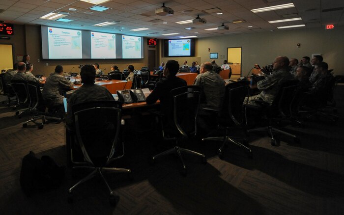 Maj. Gen. Christopher J. Bence, U.S. Air Force Expeditionary Center commander, receives a briefing on the Joint Base Charleston ride-out team for Hurricane Matthew at the Emergency Operations Center here, Dec. 14, 2016. While at JB Charleston, Bence toured Team Charleston's facilities to get a first-hand look at joint operations. 