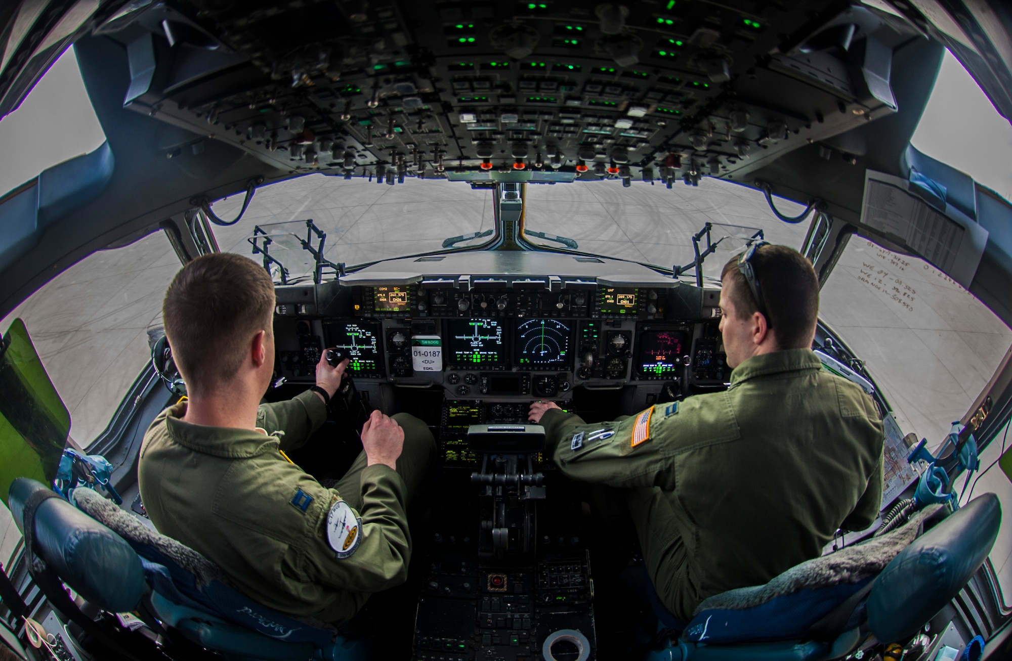 Capt. Mike “Havac” Gilpatrick, a pilot assigned to the 9th Airlift Squadron, Joint Base McGuire-Dix-Lakehurst, N.J., and Capt. Jason “Brick” Sewell, a pilot assigned to the 43rd Operation Support Squadron, Pope Air Force Base, N.C., prepare a C-17 Globemaster III for take-off before a joint forcible entry exercise at Nellis Air Force Base, Nev., Dec. 10, 2016. JFEX is a U.S. Air Force Weapons School large-scale air mobility exercise in which participants plan and execute a complex air-land operation in a simulated contested battlefield. (U.S. Air Force photo by Airman 1st Class Kevin Tanenbaum)
