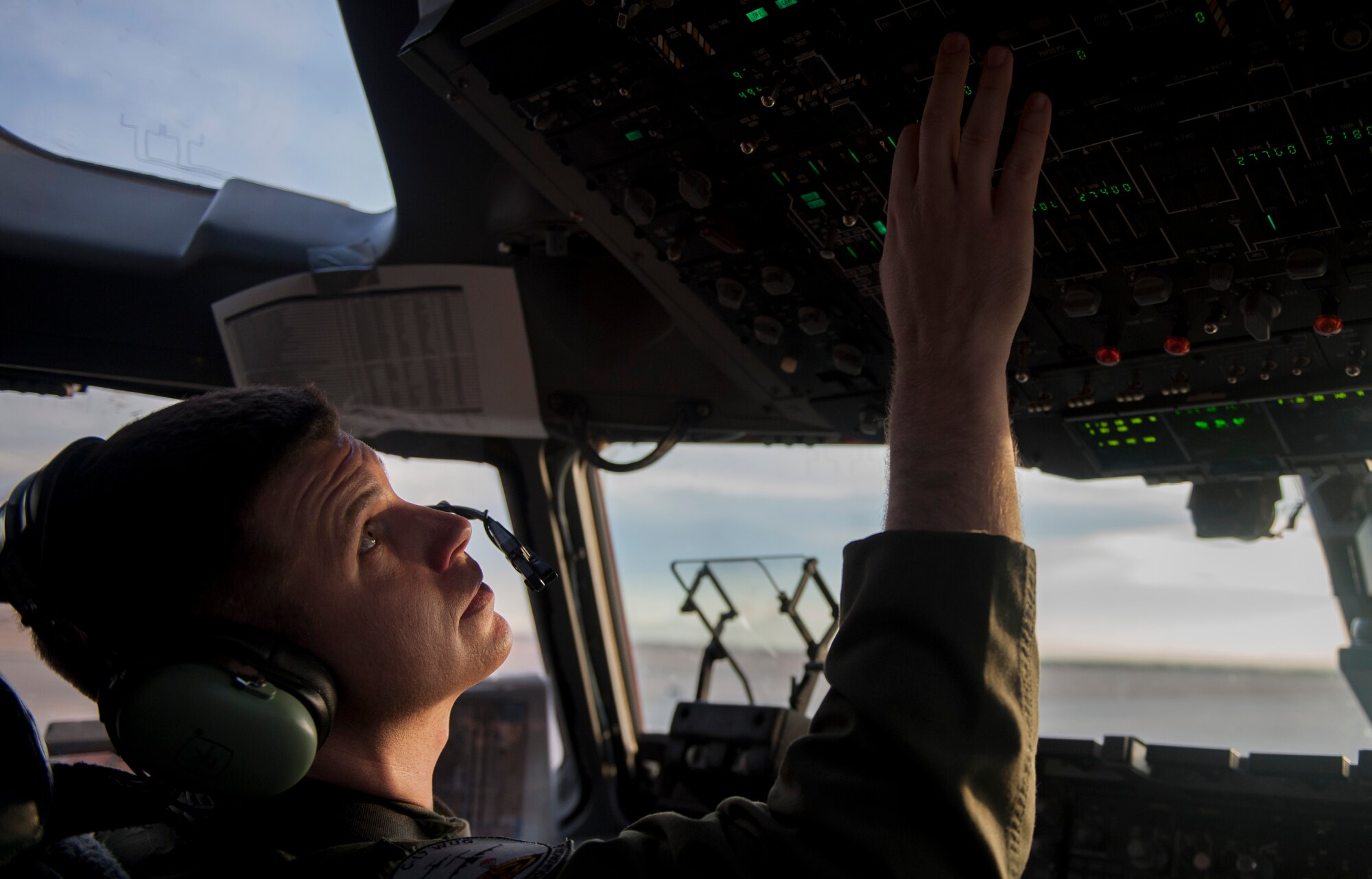 Capt. Mike “Havac” Gilpatrick, a pilot assigned to the 9th Airlift Squadron, Joint Base McGuire-Dix-Lakehurst, N.J., prepares a C-17 Globemaster III for take-off participating in a Joint Forcible Entry exercise on Nellis Air Force Base, Nev., Dec. 10, 2016. The exercise demonstrates the Air Force’s ability to tactically deliver and recover combat forces via air drops and combat landings in a contested environment. (U.S. Air Force photo by Airman 1st Class Kevin Tanenbaum)