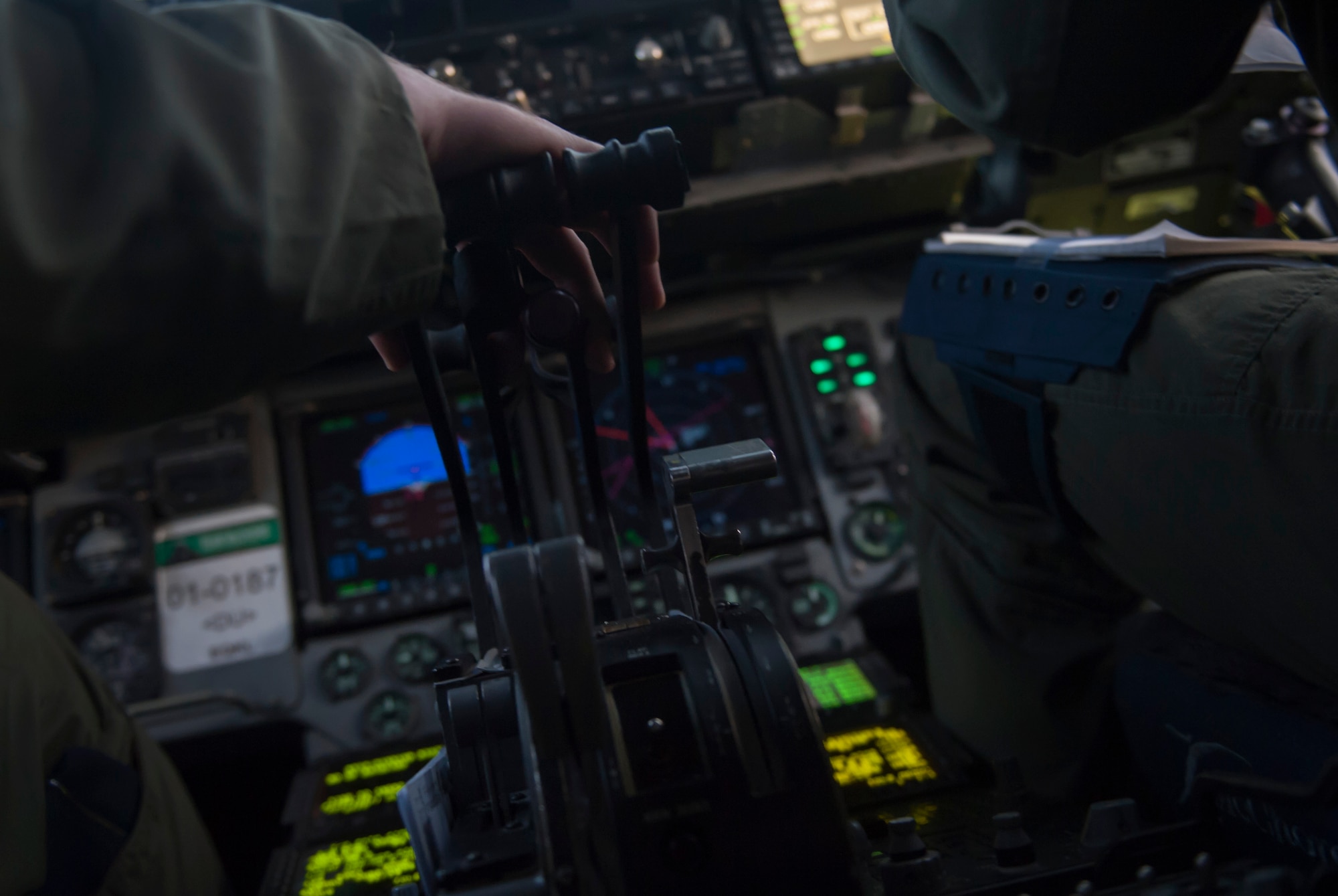 Capt. Mike “Havac” Gilpatrick, a pilot assigned to 9th Airlift Squadron pilot, Joint Base McGuire-Dix-Lakehurst, N.J., rest his hand on the throttle of a C-17 Globemaster III on Nellis Air Force Base, Nev., Dec. 10, 2016. The inherent flexibility and performance of the C-17 force improve the ability of the total airlift system to fulfill the worldwide air mobility requirements of the United States. (U.S. Air Force photo by Airman 1st Class Kevin Tanenbaum)