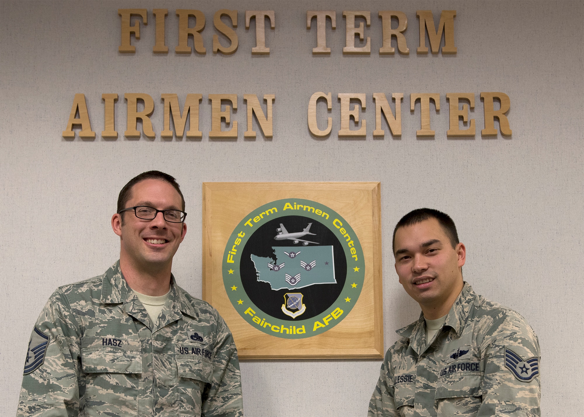 Master Sgt. Lance Hasz, 92nd Force Support Squadron career assistance advisor and Staff Sgt. Jonathan Allessie, 92nd FSS Airmen Leadership School instructor pose in front of the First Term Airmen Center sign Dec. 12, 2016 at Fairchild Air force Base, Wash. FTAC instructors assist new Airmen in acclimating to their new base and Air Force Life. (U.S. Air Force photo/Airman 1st Class Ryan Lackey)