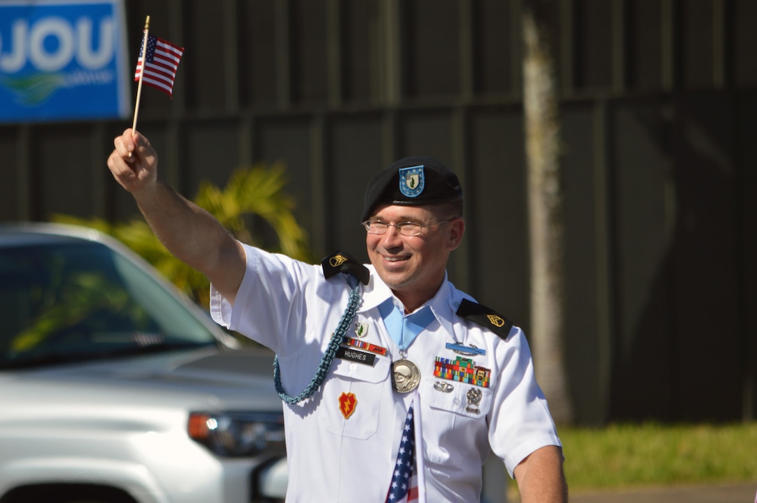 Staff Sgt. Brian Hughes is the grand marshal for the 70th Annual Wahiawa Veterans Day parade at Wahiawa, Hawaii, on Nov. 11, 2016. Hughes, a native of Euclid, Ohio and assistant operations noncommissioned officer assigned to 2nd Bn., 35th Inf. Regt., 3rd BCT, 25th ID, was recognized for his service by being made the grand marshal for the parade. (U.S. Army photo by Staff Sgt. Armando R. Limon, 3rd Brigade Combat Team, 25th Infantry Division)