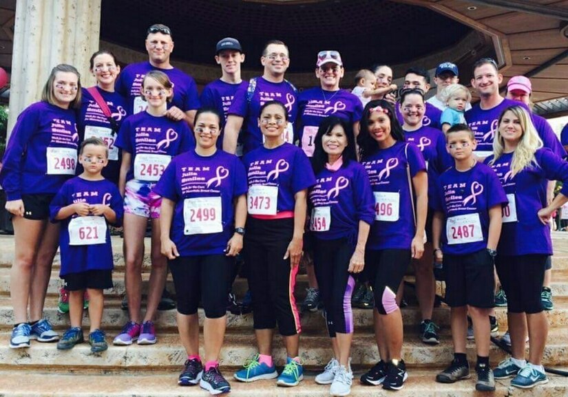 Army Staff Sgt. Brian Hughes and his wife, Julia, top center, take part in a Komen Hawaii Race for the Cure at Honolulu, Hawaii, on Oct. 16, 2016. Members of the 2nd Battalion, 35th Infantry Regiment participated in the race in support of Julia, who is a breast cancer survivor. Courtesy photo