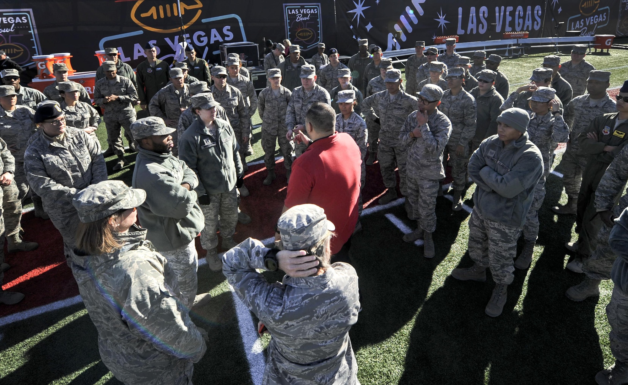 Airmen from Nellis and Creech Air Force Bases take direction on how to unfold the large American flag at Sam Boyd Stadium before the Las Vegas Bowl, Dec. 17, 2016. Mountain West champion San Diego State defeated Houston in the 25th Las Vegas Bowl, 34-10. (U.S. Air Force photo by Airman 1st Class Kevin Tanenbaum/Released)