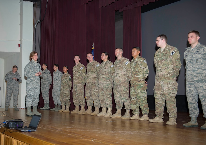 Brig. Gen. Andrea Tullos, director of Security Forces, recognizes Team Minot defenders during an all-call at Minot Air Force Base, N.D., Dec. 20, 2016. These Airmen were acknowledged for going above and beyond in their daily duties and during exercises. (U.S. Air Force photo/Senior Airman Apryl Hall)