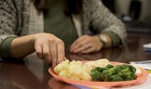 Sandra Stuart, 23d Medical Group health promotion dietitian, uses food props to show an Airman what his portions should look like, Dec. 19, 2016, at Moody Air Force Base, Ga.  Stuart provides services at no cost to all active duty, dependents, and retirees to help them meet their diet and nutrition goals. (U.S. Air Force photo by 2d Lt. Kaitlin Toner)