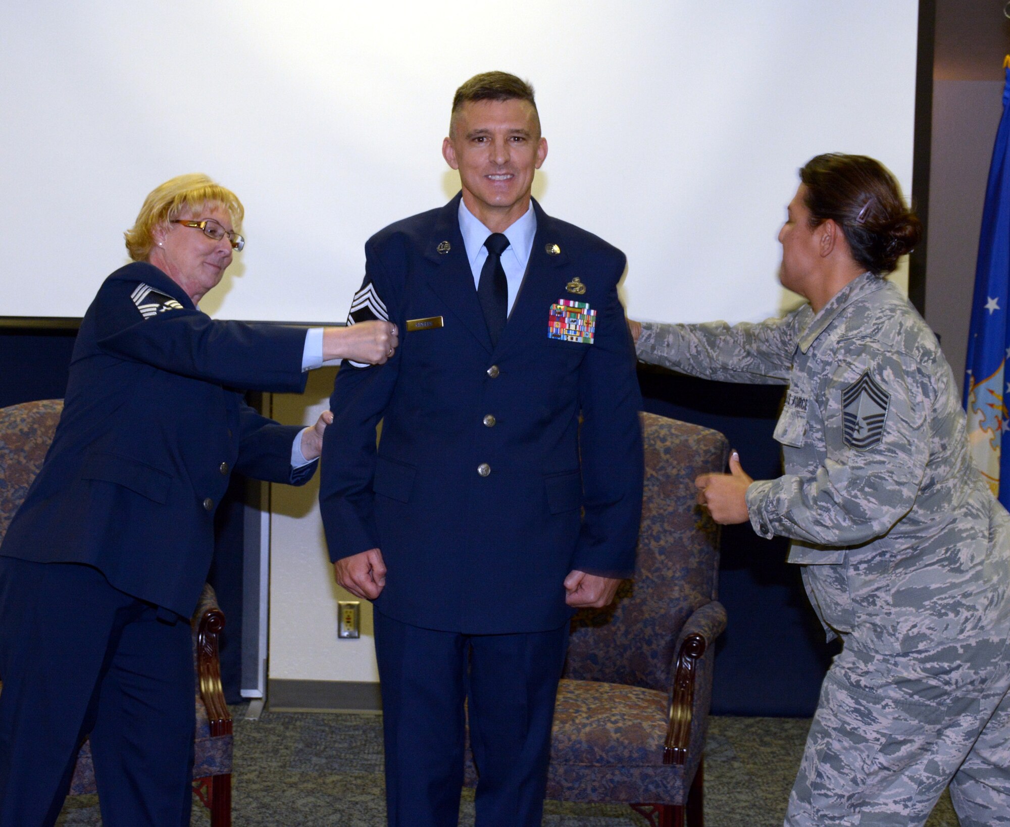 The 82nd Aerial Port Squadron gained another chief master sergeant when Scott Kirberg pinned on his new rank Nov. 12 in a ceremony at the Travis Air Force Base Passenger Terminal. Many family, friends and squadron members were on hand to help him celebrate reaching the top enlisted rank in the Air Force. (U.S. Air Force photos/Staff Sgt Martin Uy/released)