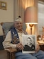 J.C. Alston, Pearl Harbor attack survivor and World War II veteran, holds a photo of himself taken during his service in the Navy. Alston shared the 75th Anniversary of the attack on Pearl Harbor with his great nephew, Tech. Sgt. Joshua Mathews from the Air Reserve Personnel Center, the week of Dec. 7, 2016, on the island of Oahu, Hawaii. (Courtesy photo)