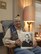 J.C. Alston, Pearl Harbor attack survivor and World War II veteran, holds a photo of himself taken during his service in the Navy. Alston shared the 75th Anniversary of the attack on Pearl Harbor with his great nephew, Tech. Sgt. Joshua Mathews from the Air Reserve Personnel Center, the week of Dec. 7, 2016, on the island of Oahu, Hawaii. (Courtesy photo)