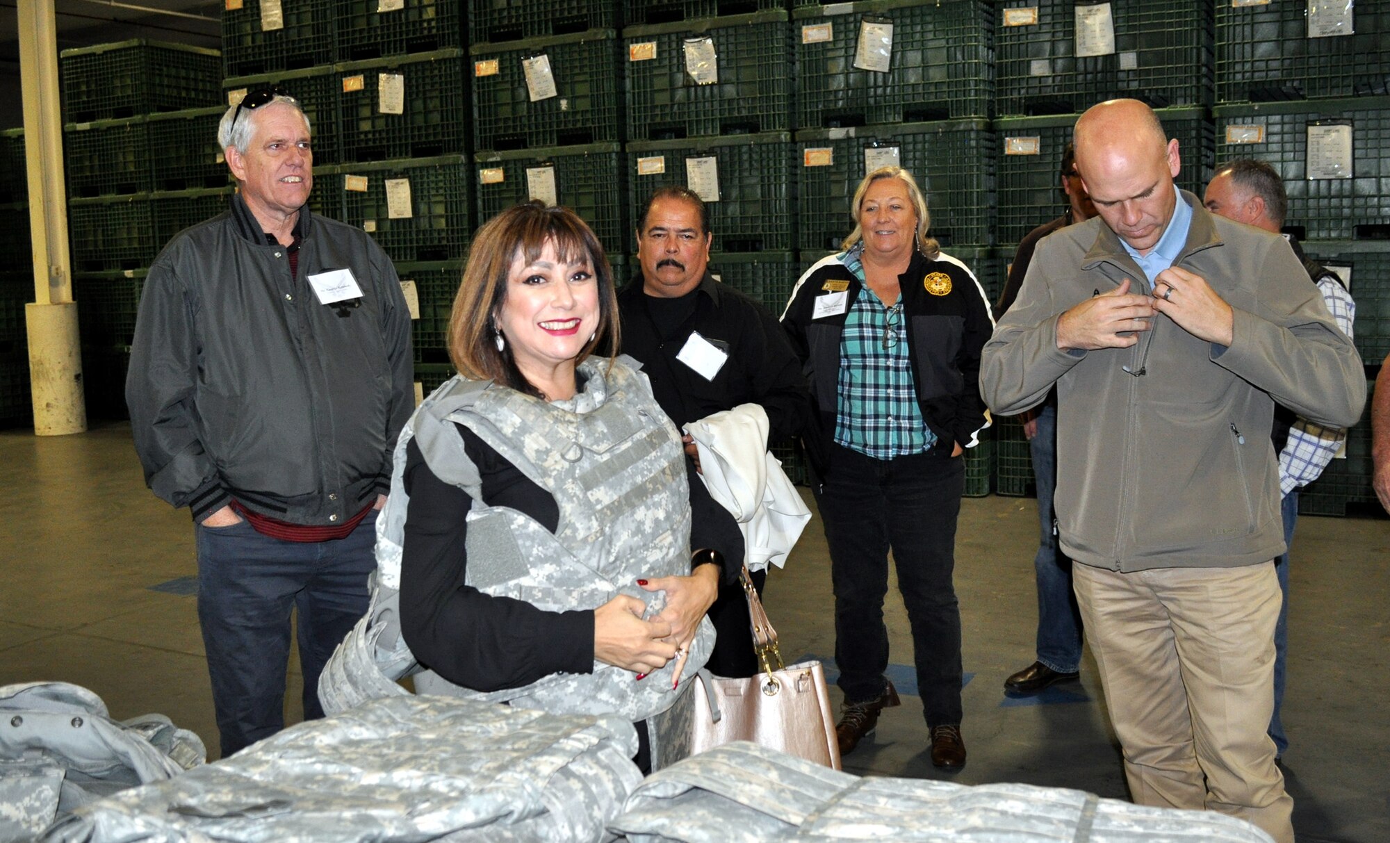 Travis Honorary Commanders got a look behind the scenes of some of the Mission Support Group squadrons on the final 2016 group tour Dec. 2. After lunch at the Sierra Inn Dining Facility, about 25 HCCs reported to the Personnel Deployment Function line at building P1, as they prepared to deploy to the mythical land of TRAFCstan. At TRAFCstan, they participated in hands-on firing – safely done – of the M4 rifle and M9 pistol, let by Security Forces. They learned about the Explosive Ordinance Disposal equipment, and how to spot explosive devices, and Chemical, Biological, Radiological and Nuclear Survival Skills using CBRN protective equipment. At the Emergency Operations Center, Mr. Mark Wilson talked about emergency management at home station and in the war zone. Their final stop was the Telephone Operator Consolidate Call Center of the West, a unique center that employs disabled personnel who use specialized software to support telephone operations for three major commands. Participating 349th Air Mobility Wing HCCs were Mr. Chris Dage, HCC for Wing Commander, Col. Raymond Kozak, Mr. Monte Hoover, HCC for Col. Jeff Pickard, 349th Maintenance Group commander, Mrs. Kelly Placeres, HCC to Col. Adrian White, 349th AMW vice commander, and Mr. George Kennedy, HCC to Lt. Col. Keith Whitehouse, 70th Air Refueling Wing commander. The Change of Command Ceremony for the 2017 HCCs will be February 2, 2017, in Hangar 837. (U.S. Air Force photos/Ellen Hatfield/released)
