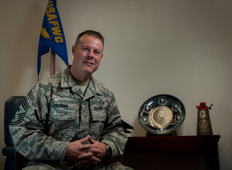 Command Chief Master Sgt. Charles R. Hoffman poses for a portrait in the United States Air Force Warfare Center on Nellis Air Force Base, Nev., Dec. 6, 2016. Hoffman recently took over as the new Command Chief of the USAFWC, coming from a diverse assignment background spanning Air Force and Army field units at the MAJCOM, group, squadron, brigade, and higher headquarter Army levels. (U. S. Air Force photo by Airman 1st Class Kevin Tanenbaum)