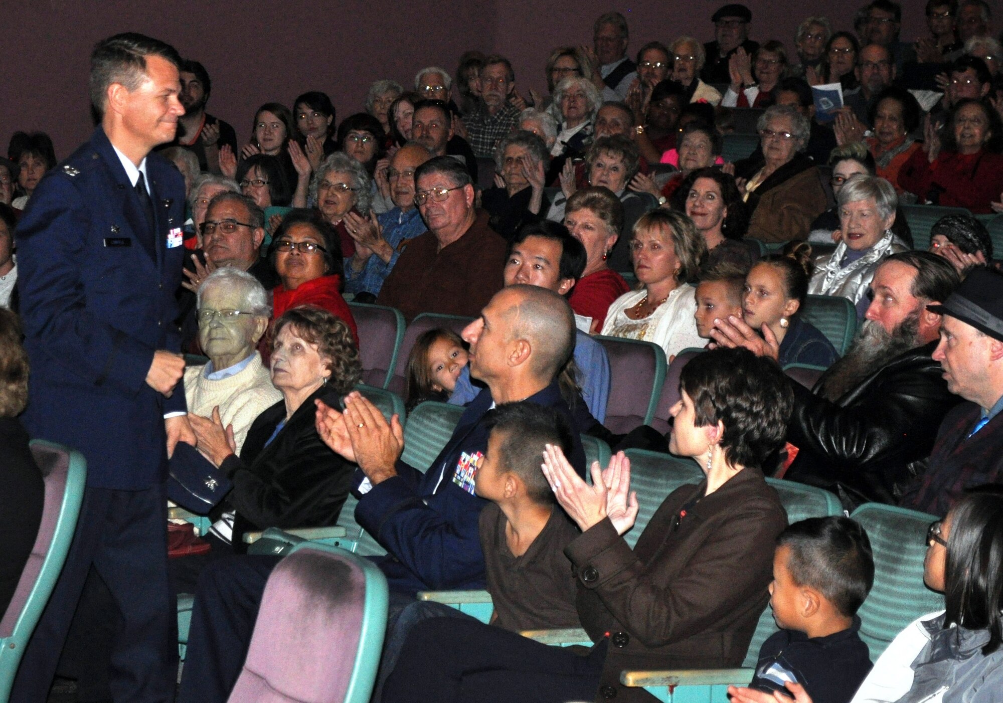 A tradition for Travis Air Force Base is the annual community Holiday Concert Series by the U.S. Air Force Band of the Golden West. This year, as in the past, they continue to bring joy, delight and world class music to young and old alike. Helping to kick off the Dec. 3, concert at the Vacaville Performing Arts Theater was Col. (Dr) John Langell, 349th Medical Group commander. He left behind 64 inches of snow near Salt Lake City, Utah, which is home. Under the direction of Capt. Rafael F. Toro-Quinones, the band played a variety of holiday selections, with vocal performances by Amn First Class Stephanie Allen, Senior Amn Michelle Doolittle, and SrA George Brahler, recently named Bandsman of the Year, and performing in his final holiday concert here. Santa stopped by to visit with all the children in the audience, with a little something special in his big red bag for them all. (U.S. Air Force photos/Ellen Hatfield/released)