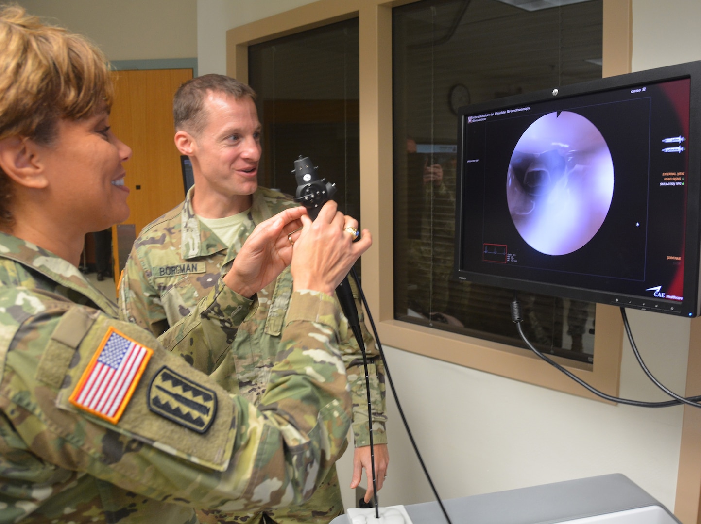 Lt. Gen. Nadja West (left), U.S. Army Surgeon General, experiments with the bronchoscope simulator with the assistance of Lt. Col. Matthew Borgman during her visit to Brooke Army Medical Center at Joint Base San Antonio-Fort Sam Houston Dec. 14. This was West’s first visit since she became surgeon general. She toured several areas within the hospital including the simulation center, burn center, emergency department, rooftop helipad, and then went to the Center for the Intrepid. 