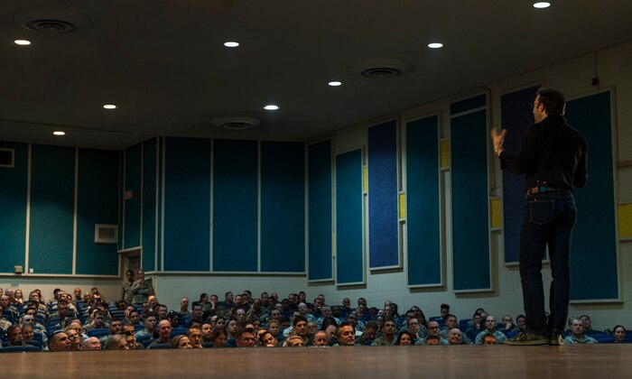 Simon Sinek speaks to Airmen of the 57th Wing in the Base Theater of Nellis Air Force Base, Dec. 9, 2016. Sinek has been featured on TED talks on how to inspire, lead and manage individuals. (U.S. Air Force Base by Airman 1st Class Kevin Tanenbaum/Released)