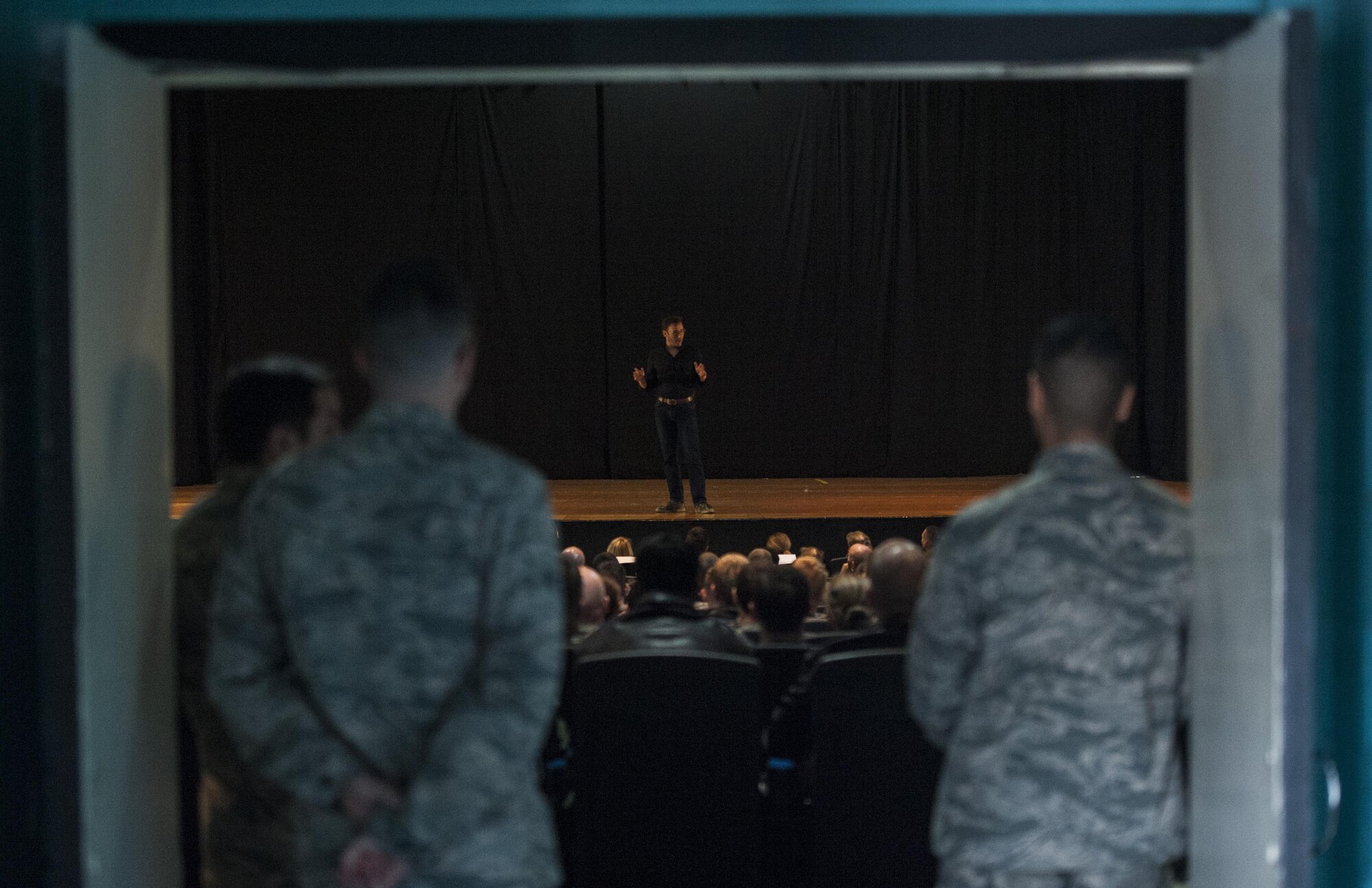 Airmen from the 57th Wing listen as Simon Sinek talks in the Base Theater of Nellis Air Force Base, Dec. 9, 2016. Sinek is an author, speaker, and consultant who writes on leadership and management. (U.S. Air Force Base by Airman 1st Class Kevin Tanenbaum/Released)