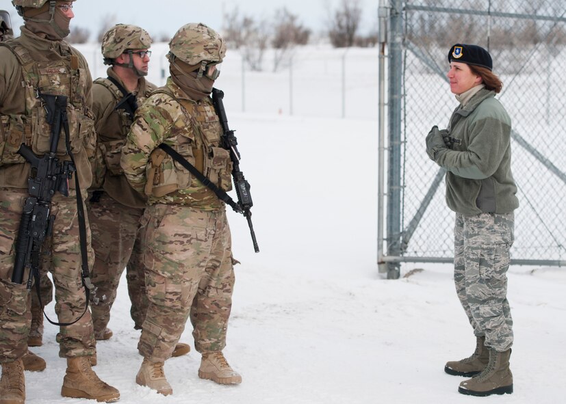Brig. Gen. Andrea Tullos, director of Security Forces, speaks with 791st Missile Security Forces Squadron defenders at a training facility at Minot AFB, N.D., Dec. 19, 2016.  During her visit, Tullos met with base leadership and visited security forces units to witness Minot’s austere weather change daily operations. (U.S. Air Force photo/Airman 1st Class J.T. Armstrong)
