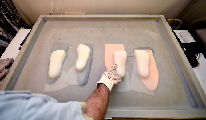 Staff Sgt. Devin Rudd, a student in the orthotics program, checks to see if the plastic for a foot orthoses has settled at the Wilford Hall Ambulatory Surgical Center, Joint Base San Antonio-Lackland, Texas, Aug. 24, 2016.(U.S. Air Force photo/Staff Sgt. Jerilyn Quintanilla)