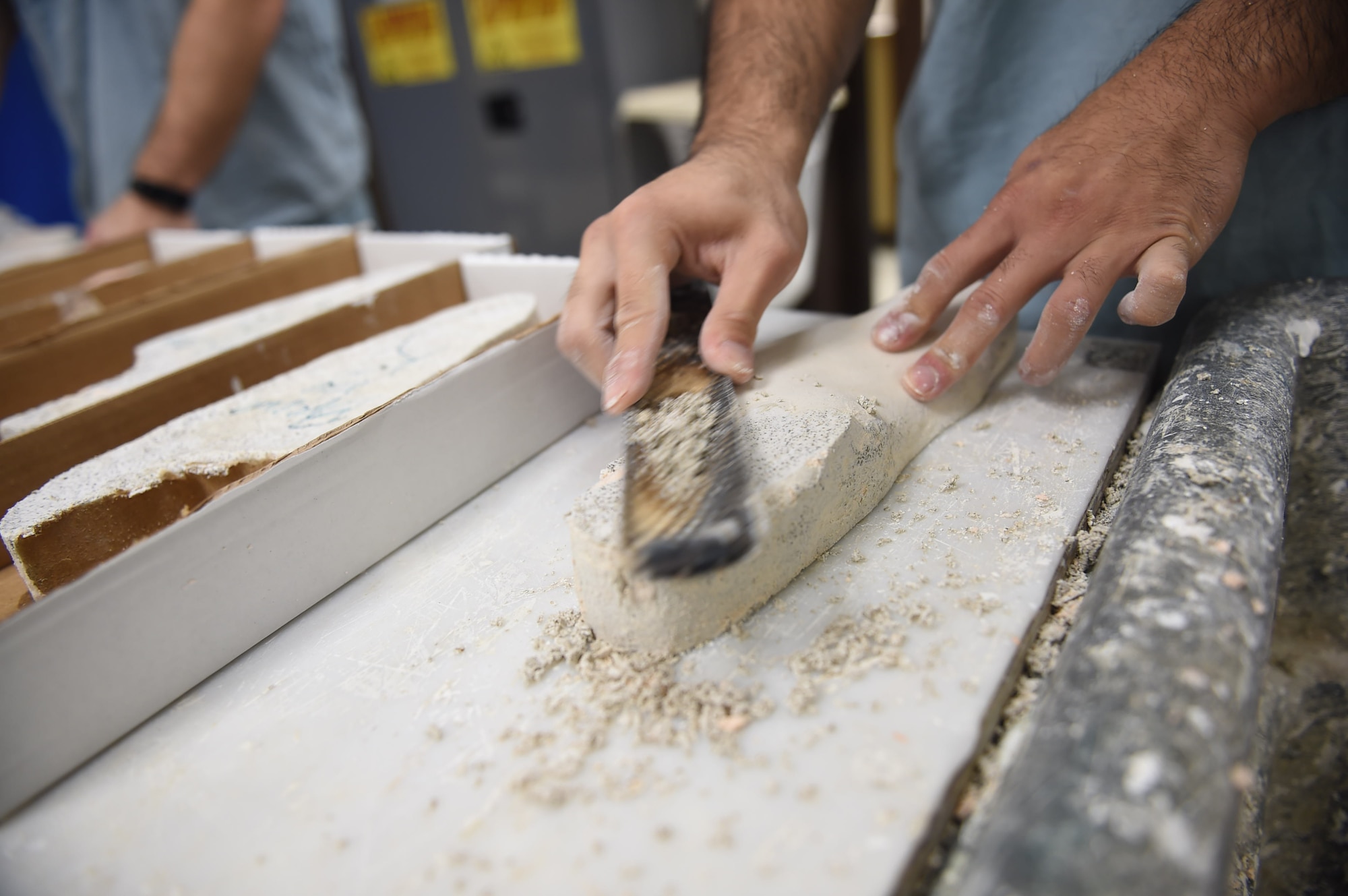 Staff Sgt. Kenneth Rivera, a student in the orthotics program, smooths the surfaces of mold for a foot orthoses at the Wilford Hall Ambulatory Surgical Center, Joint Base San Antonio-Lackland, Texas, Aug. 24, 2016.(U.S. Air Force photo/Staff Sgt. Jerilyn Quintanilla)