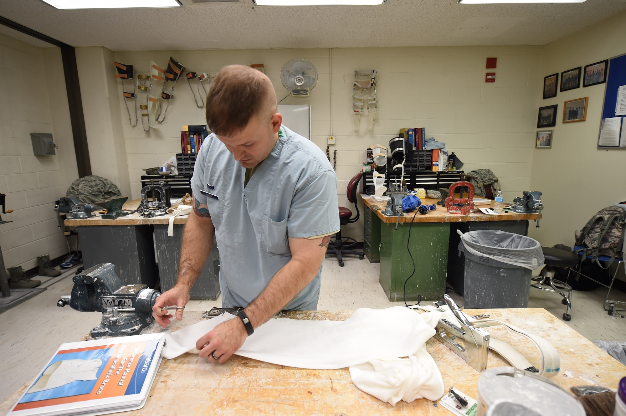 Staff Sgt. Devin Rudd, a student in the orthotics program, measures plaster cloth to make a body jacket orthoses at the Wilford Hall Ambulatory Surgical Center, Joint Base San Antonio-Lackland, Texas, Aug. 24, 2016. (U.S. Air Force photo/Staff Sgt. Jerilyn Quintanilla)