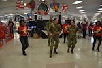 The Exchange at Joint Base San Antonio-Fort Sam Houston opened early Dec. 10 to give Soldiers, Airmen and Sailors studying at the Medical Education and Training Campus the chance to buy, wrap and ship holiday gifts to friends and family during the AIT Holiday Shopping Event. Service members also cut loose on the dance floor, won prizes and took photos with Santa.