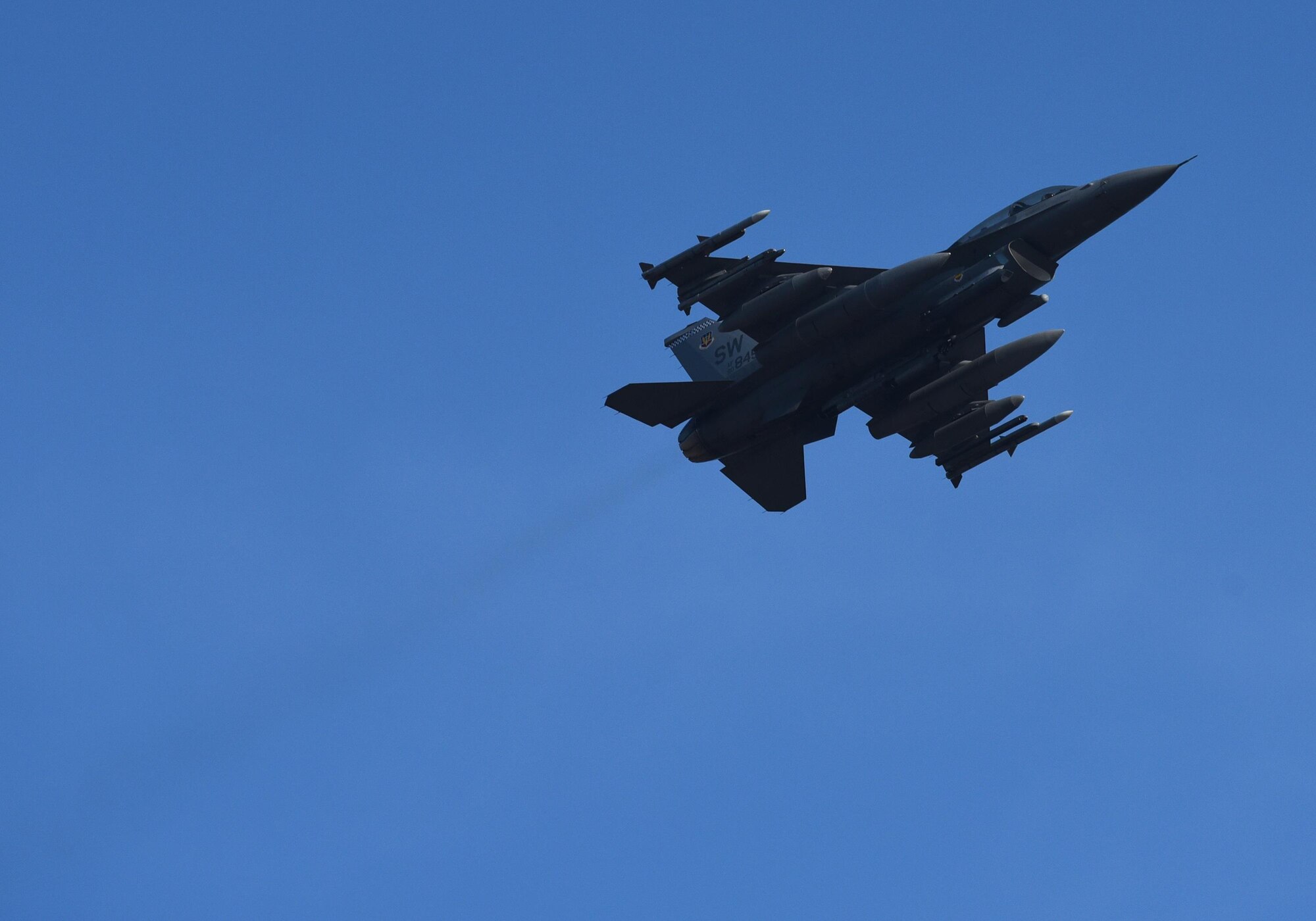 A U.S. Air Force F-16CM Fighting Falcon from the 20th Fighter Wing, Shaw Air Force Base, S.C., flies above the flightline at Tyndall Air Force Base, Fla., Dec. 16, 2016. Shaw AFB sent 16 F-16s and approximately 140 Airmen to participate in the Checkered Flag 17-1 and Combat Archer 17-3, a large-scale, aerial total force integration exercise. (U.S. Air Force photo by Staff Sgt. Alex Fox Echols III/Released)