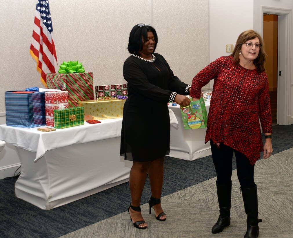 Active-duty Sailors and civilian personnel at Naval Branch Health Clinic-Albany, aboard Marine Corps Logistics Base Albany, kick off the holiday season at the Hilton Garden Inn, Albany, Ga., Dec. 15. Staff and guests participated in door-prize drawings as well as “White Elephant” gift exchanges and a plated-banquet feast.
