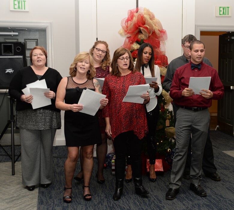 Active-duty Sailors and civilian personnel at Naval Branch Health Clinic-Albany, aboard Marine Corps Logistics Base Albany, kick off the holiday season at the Hilton Garden Inn, Albany, Ga., Dec. 15. Personnel entertained colleagues and guests with an acappella selection of holiday carols.

