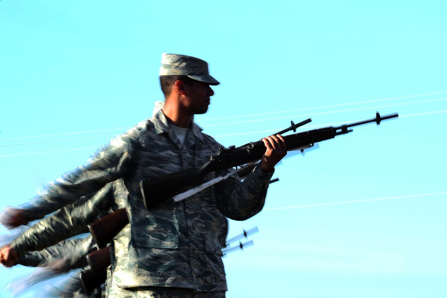 U.S. Airmen assigned to the 20th Force Support Squadron Honor Guard fire rifles during a firing party detail at Shaw Air Force Base, S.C., Dec. 14, 2016. Firing parties are performed during ceremonies such as funerals to serve as salutes, and consist of firing three blank rounds into the air upon command. (U.S. Air Force photo by Airman 1st Class Christopher Maldonado)