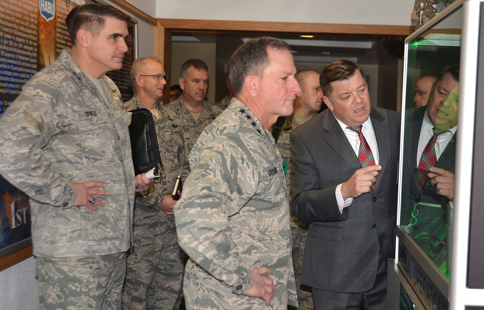 Gabriel Marshall, staff historian, 25th Air Force, explains a special operations exhibit in the Dennis F. Casey Heritage Hall to Air Force Chief of Staff Gen. David L. Goldfein during his visit to San Antonio, Texas, Dec. 19.