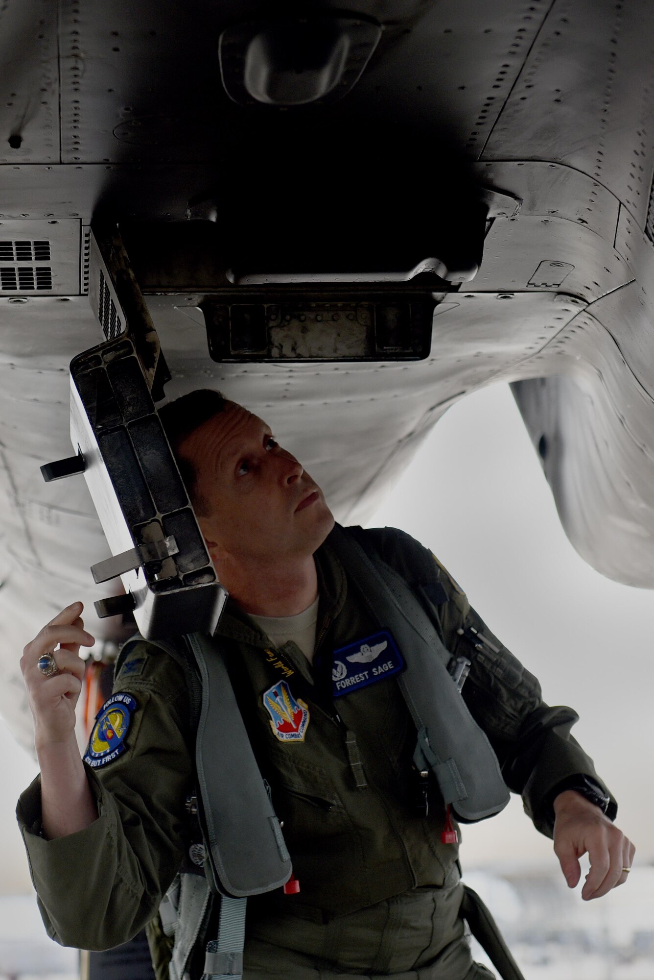 Col. Christopher Sage, 4th Fighter Wing commander, performs a preflight check on an F-15E Strike Eagle before take-off, Nov. 30, 2016, at Seymour Johnson Air Force Base, North Carolina. Pilots conduct preflight checks to ensure the safety and reliability of their aircraft. (U.S. Air Force photo by Airman 1st Class Kenneth Boyton)