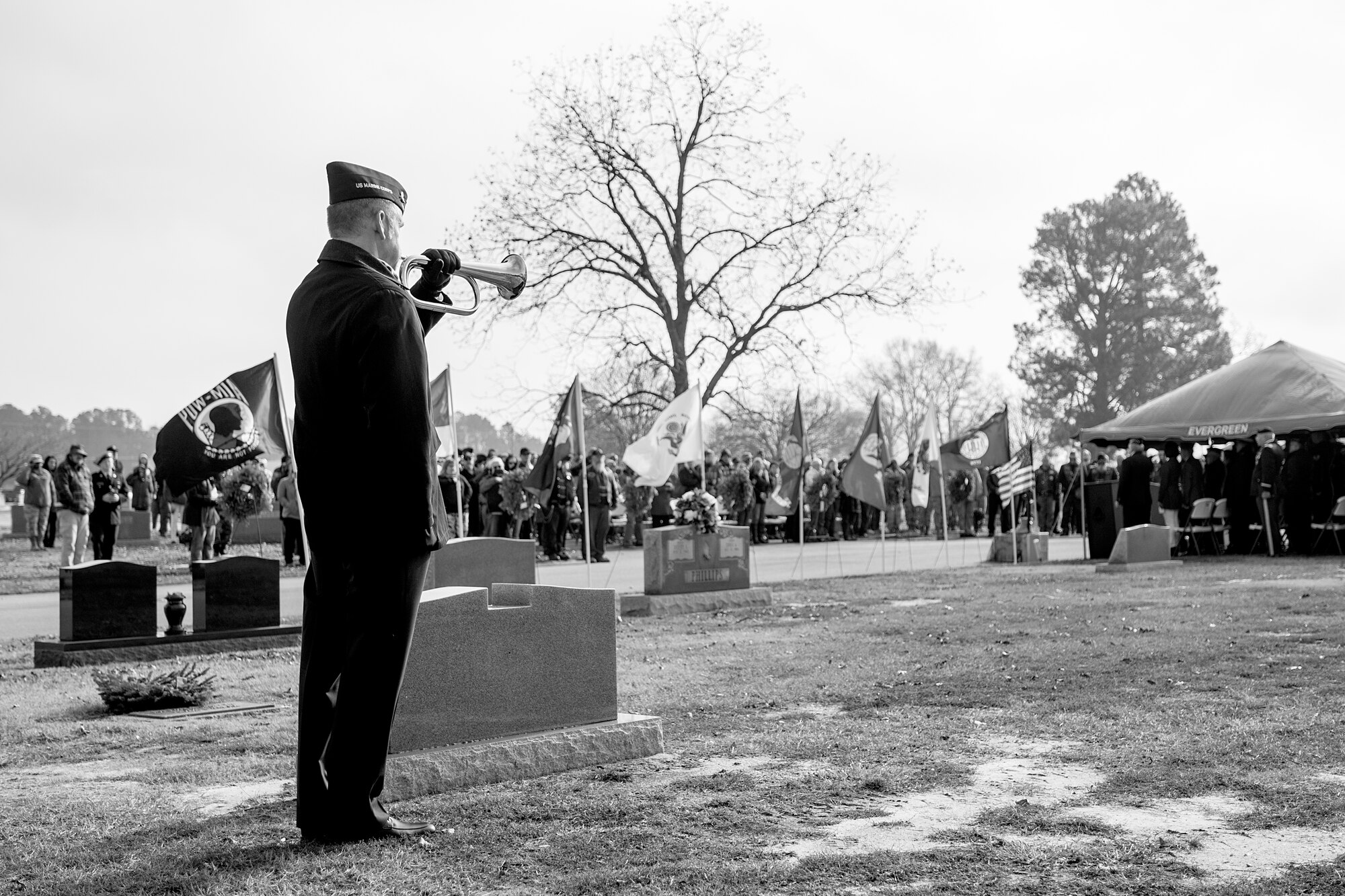 A lone bugle player plays taps to sound the end of a Wreaths Across America ceremony, Dec. 17, 2016, at Evergreen Memorial Cemetery in Princeton, North Carolina. More than 200 people attended the ceremony with over 50 volunteers from Seymour Johnson Air Force Base, North Carolina helping with the ceremony and laying of the 500 wreaths. (U.S. Air Force photo by Airman Shawna L. Keyes)