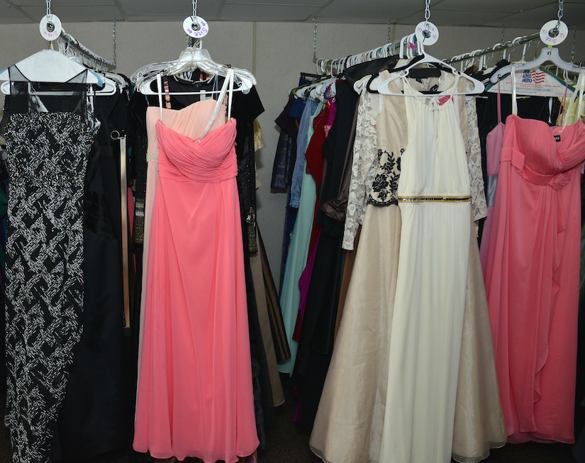 Dresses hang at the Operation Deploy Your Dress boutique, a non-profit organization led by military spouses located at Joint Base Langley-Eustis, Va., Dec. 20, 2016. ODYD provides free gently-used or new formal attire to military families to help reduce the cost of attending formal military events. (U.S. Air Force photo by Airman 1st Class Tristan Biese)