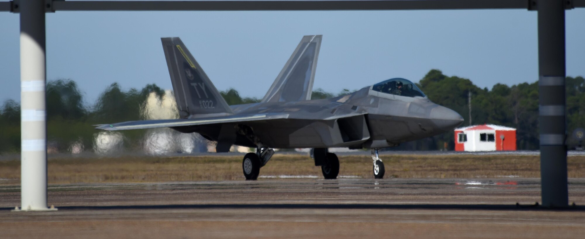 A U.S. Air Force F-22 Raptor from Tyndall Air Force Base, Fla., taxies down the flightline at Tyndall during Checkered Flag 17-1 Dec. 14, 2016. The 325th Fighter Wing hosted more than 90 aircraft and over 800 Airmen during Checkered Flag 17-1, a large-scale aerial total force integration exercise. (U.S. Air Force photo by Senior Airman Solomon Cook/Released)