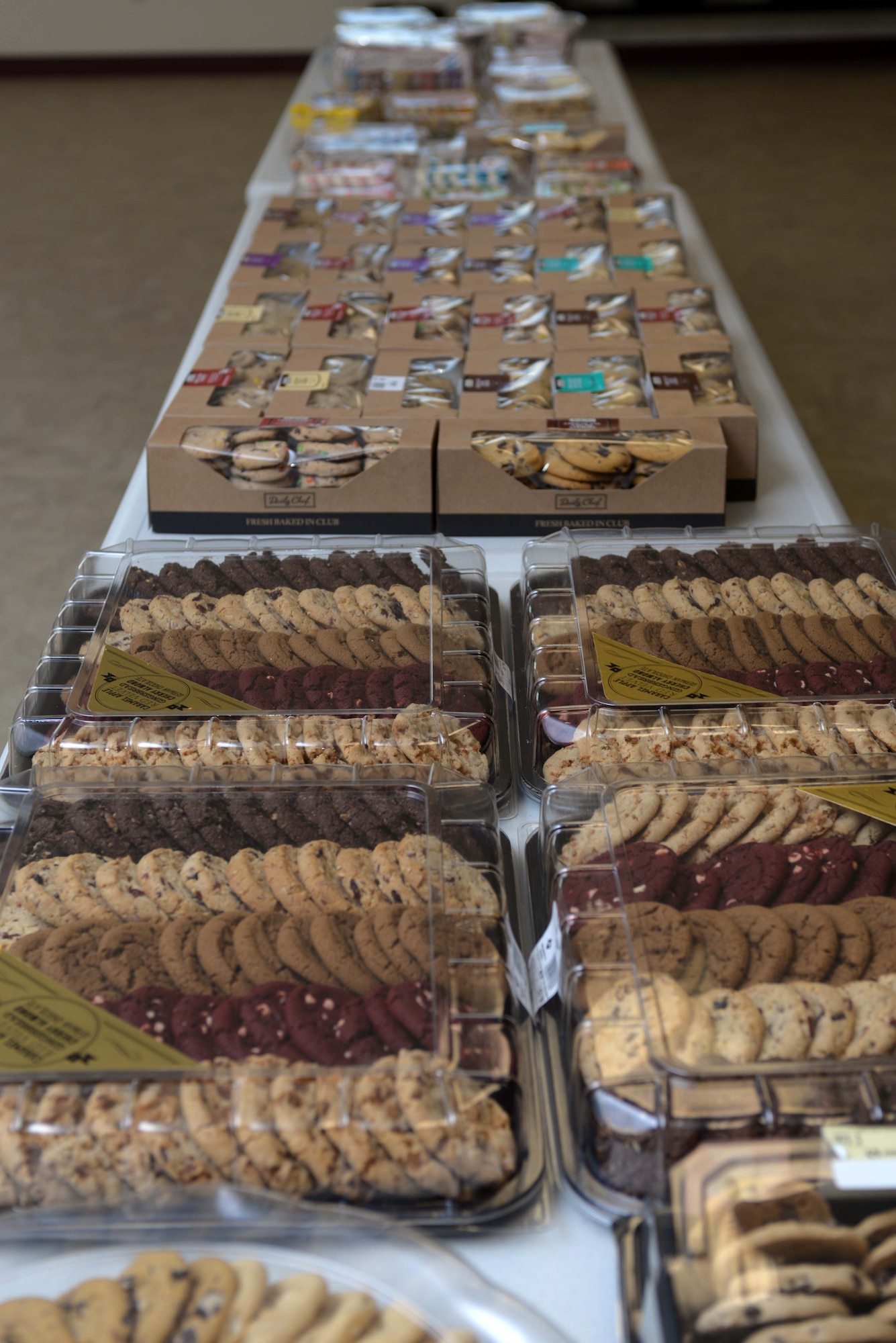 Thousands of cookies are set and prepared for sorting in the Box Elder Event Center, S.D., Dec. 14, 2016. The Enlisted Spouses' Club and the Officer and Civilian Spouses' Club received and baked more than 10,400 cookies for Airmen assigned to Ellsworth Air Force Base. (U.S. Air Force photo by Airman 1st Class Donald C. Knechtel)