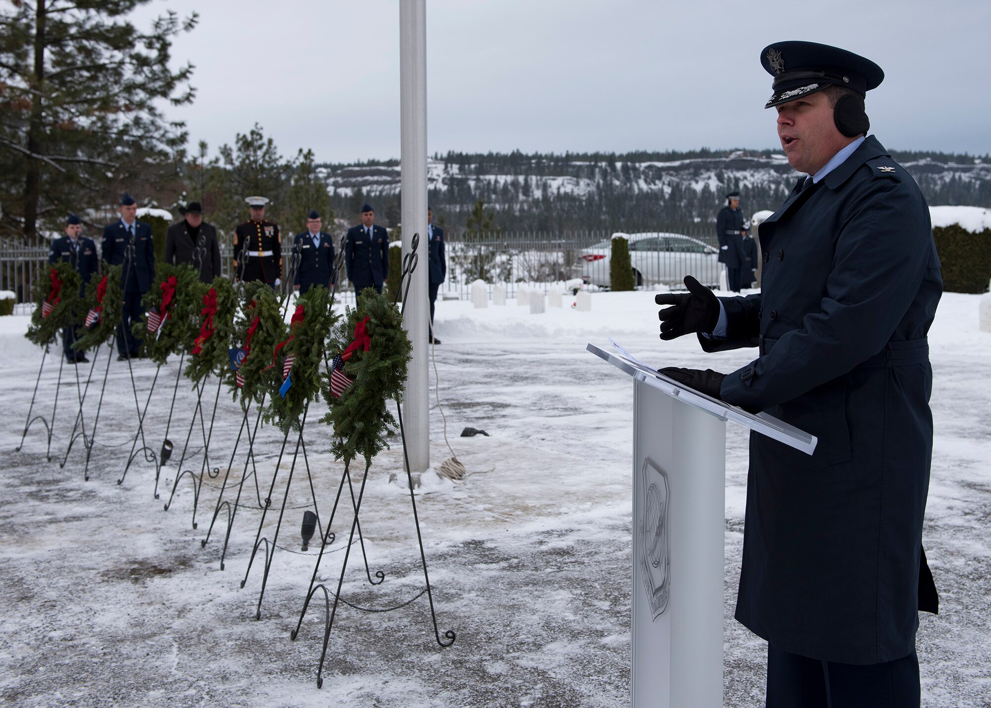 Col. Matthew Fritz, 92nd Air Refueling Wing vice commander, delivers a speech to those in attendance during a ceremony at Fort George Wright Cemetery Dec. 19, 2016, near Spokane, Wash. Fritz thanked the attendees for braving the frigid weather in order to pay tribute to the deceased veterans buried at the site. (U.S. Air Force photo/Airman 1st Class Ryan Lackey)