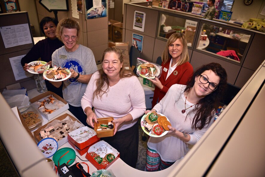 Members of the 932nd Airlift Wing Key Spouse Program build plates of cookies to distribute throughout the Wing, Dec. 4, 2016, Scott Air Force Base, Illinois. The Key Spouse is an official unit/family program designed to enhance readiness and establish a sense of Air Force community. It is a commander’s program that promotes partnerships with unit leadership, volunteer Key Spouses appointed by the commander, families, the Airman & Family Readiness Center and other community and helping agencies. The program has been standardized across the Air Force to address the needs of all military families with special emphasis on support to families across the deployment cycle. (U.S. Air Force photo by Tech. Sgt. Christopher Parr)