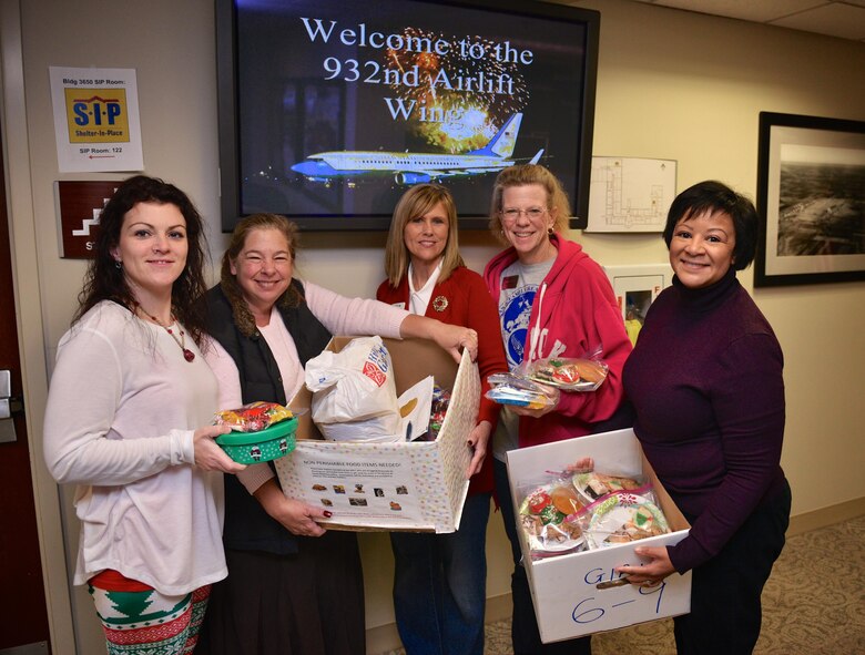 932nd Airlift Wing Key Spouses deliver cookies Dec. 4, 2016 at Scott Air Force Base, Illinois during the December unit training assembly as a way to show holiday spirit and support the 932nd AW. (U.S. Air Force photo by Tech. Sgt. Christopher Parr)