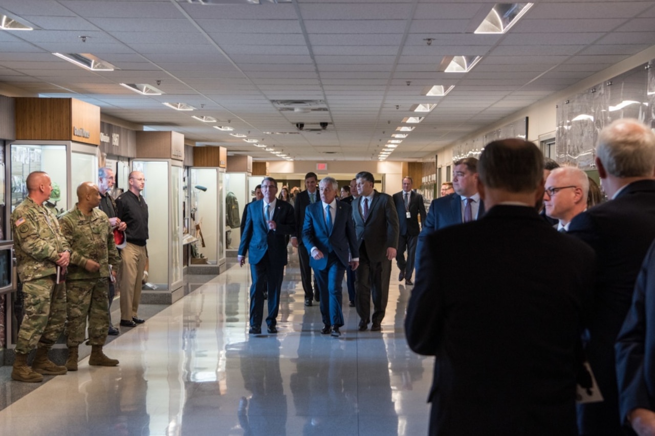 Former Defense Secretary Chuck Hagel, flanked by Defense Secretary Ash Carter and Michael Rhodes, deputy of
administration, Office of the Deputy Chief Management Officer,  arrive for the opening of a Pentagon exhibit commemorating the 50th anniversary of the Vietnam War, Dec. 20, 2016. DoD photo by Air Force Staff Sgt. Jette Carr
