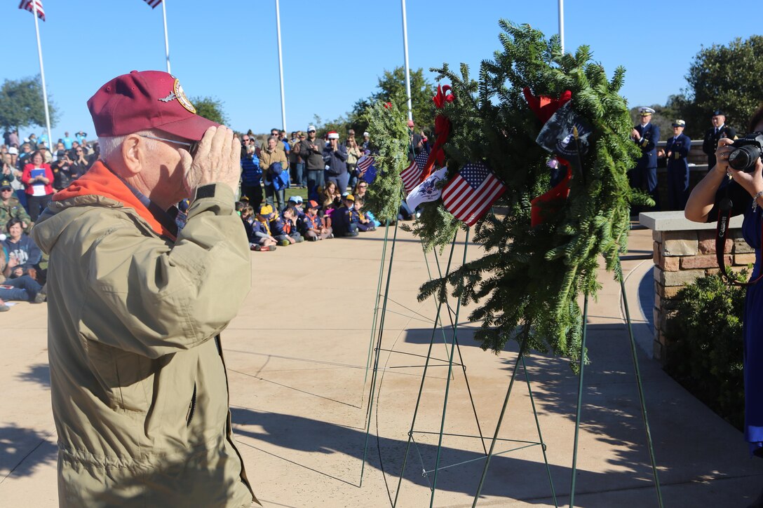 A retired service member salutes a wreath dedicated to those killed in action and prisoners of war, Dec. 17, during a Wreaths Across America ceremony at Miramar National Cemetery, San Diego, Calif., Dec.17. Through Wreaths Across America, more than 1.2 million wreaths were placed in 1,228 cemeteries across the country. The mission of Wreaths Across America is to remember fallen U.S. troops, honor those who serve and teach new generations about the value of freedom through the service and sacrifice of veterans. (U.S. Marine Corps photo by Lance Cpl. Jacob Pruitt/Released)