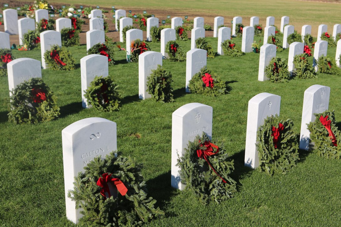 Wreaths lay at the headstones of service members after a Wreaths Aross America ceremony at Miramar National Cemetery, San Diego, Calif., Dec.17. Through Wreaths Across America, more than 1.2 million wreaths were placed in 1,228 cemeteries across the country. The mission of Wreaths Across America is to remember our fallen U.S. troops, honor those who serve and teach new generations about the value of freedom through the service and sacrifice of veterans. (U.S. Marine Corps photo by Lance Cpl. Jacob Pruitt/Released)