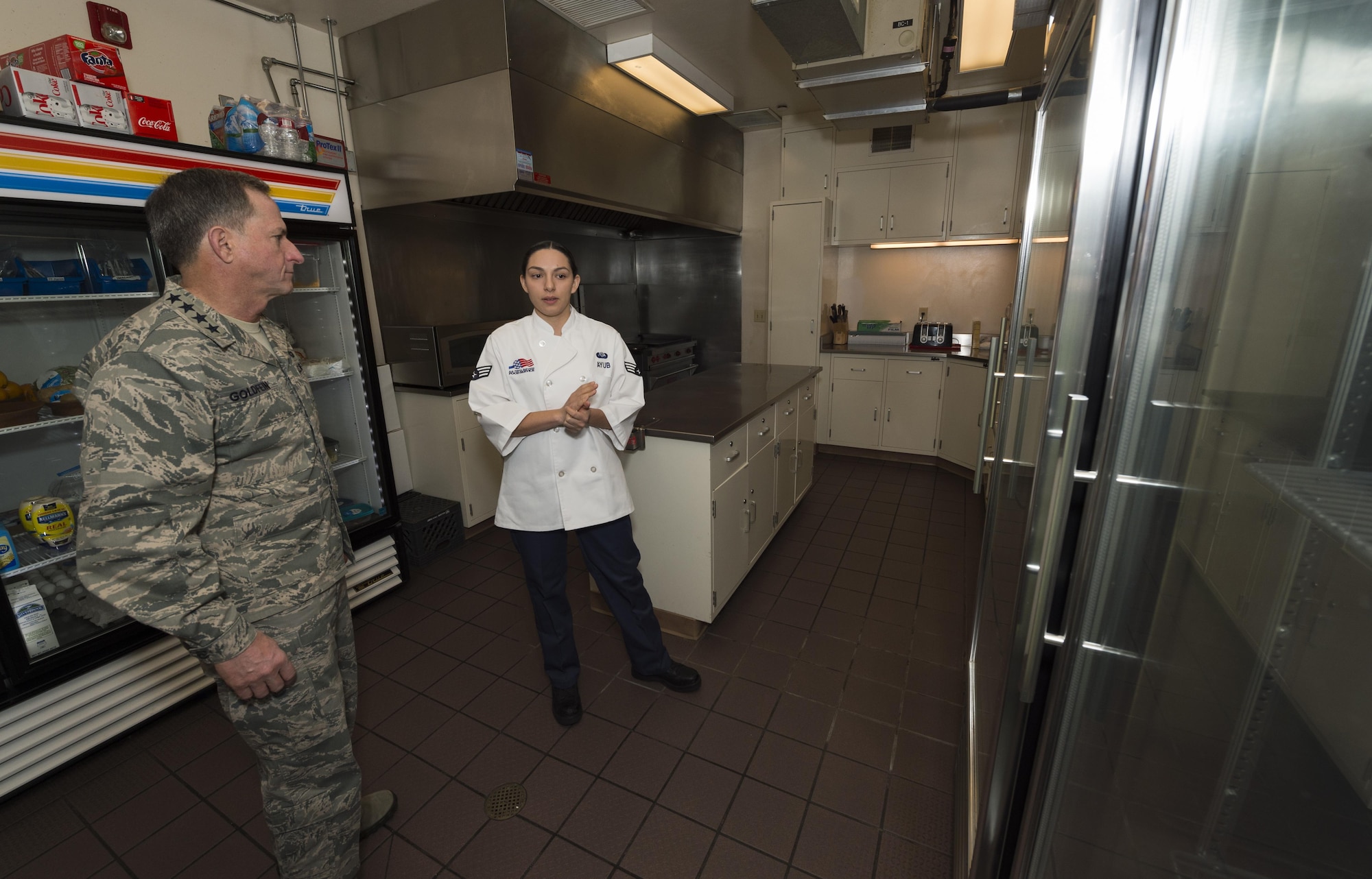 Senior Airman Alexandra Ayub, 90th Force Support Squadron missile chef, explains her job to Air Force Chief of Staff Gen. David L. Goldfein during a familiarization tour at a missile alert facility in the 90th Missile Wing missile complex, Dec. 19, 2016. Ayub is responsible for cooking for all personnel at the missile alert facility. (U.S. Air Force photo by Staff Sgt. Christopher Ruano)
