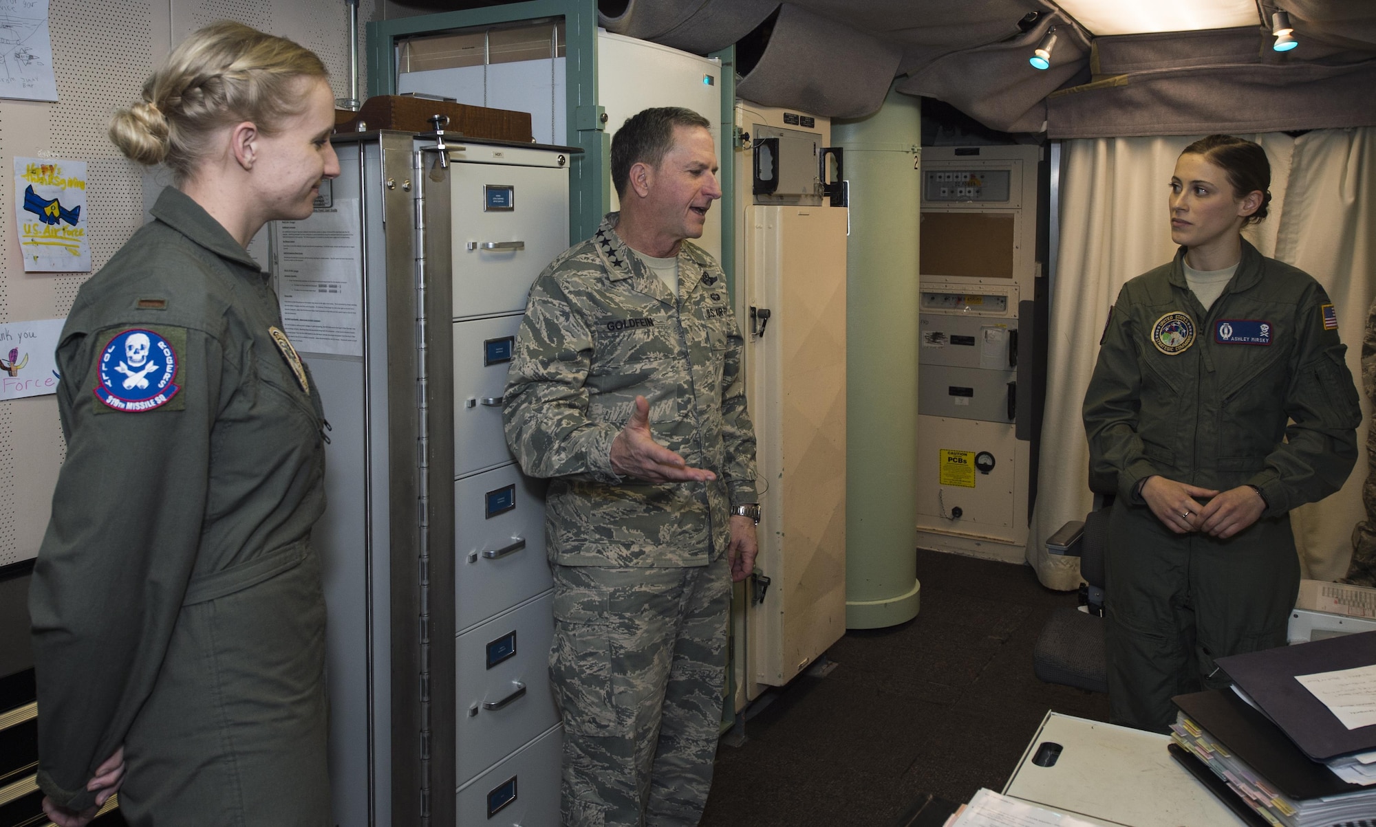 Air Force Chief of Staff Gen. David L. Goldfein receives a tour of the launch control center from 1st. Lt. Ashley Mirsky, 319th Missile Squadron missile combat crew commander, and 2nd Lt. Marie Blair, 319th MS deputy missile combat crew commander, during a familiarization tour at a missile alert facility in the 90th Missile Wing missile complex, Dec. 19, 2016.  When directed by the U.S. President, a properly conducted key turn sends a "launch vote" to any number of Minuteman III ICBMs in a missileer's squadron. Two different launch votes are required to enable a launch. (U.S. Air Force photo by Staff Sgt. Christopher Ruano)