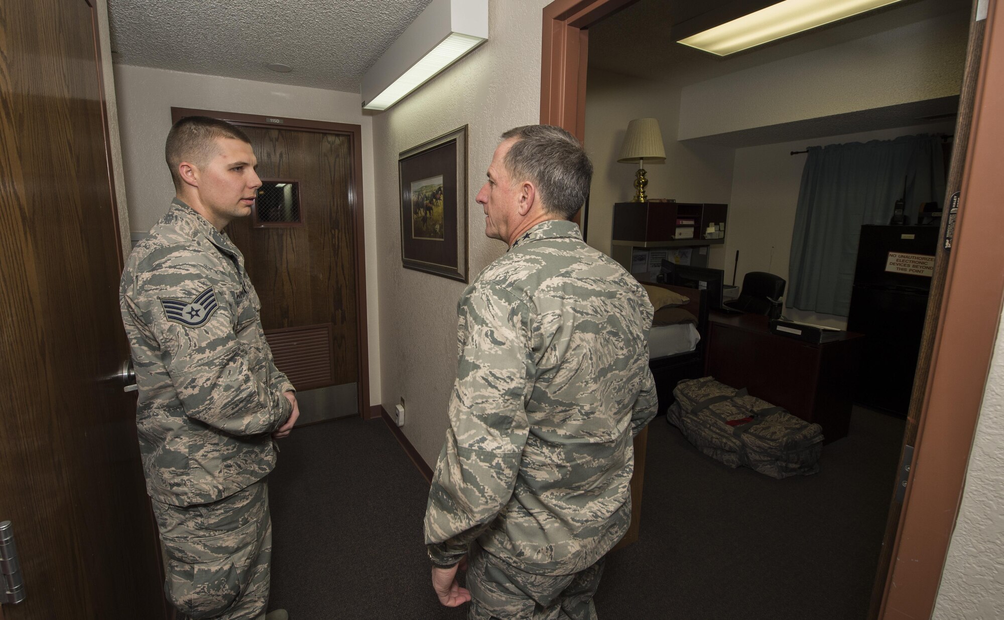 Staff Sgt. Kurtis Wimberly, 319th Missile Squadron facility manager, provides a tour of the missile alert facility to Air Force Chief of Staff Gen. David L. Goldfein during a familiarization tour at a missile alert facility in the 90th Missile Wing missile complex, Dec. 19, 2016. This was Goldfein’s first visit to an ICBM wing as the CSAF. (U.S. Air Force photo by Staff Sgt. Christopher Ruano) 
