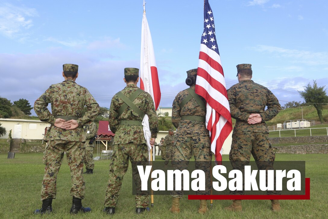 U.S. Marines with 3d Marine Expeditionary Brigade and service members of the Japan Ground Self- Defense Force prepare to perform color guard duty, Dec. 7, 2016, in Okinawa, Japan during the opening ceremony of Yama Sakura 71. The purpose of YS 71 is to both nation’s combat readiness and interoperability while strengthening bilateral relationships and demonstrating U.S. resolve to support security interests of allies and partners in the Indo-Asia-Pacific region.(U.S. Marine Corps Photo by Cpl. Carl King/. Released)