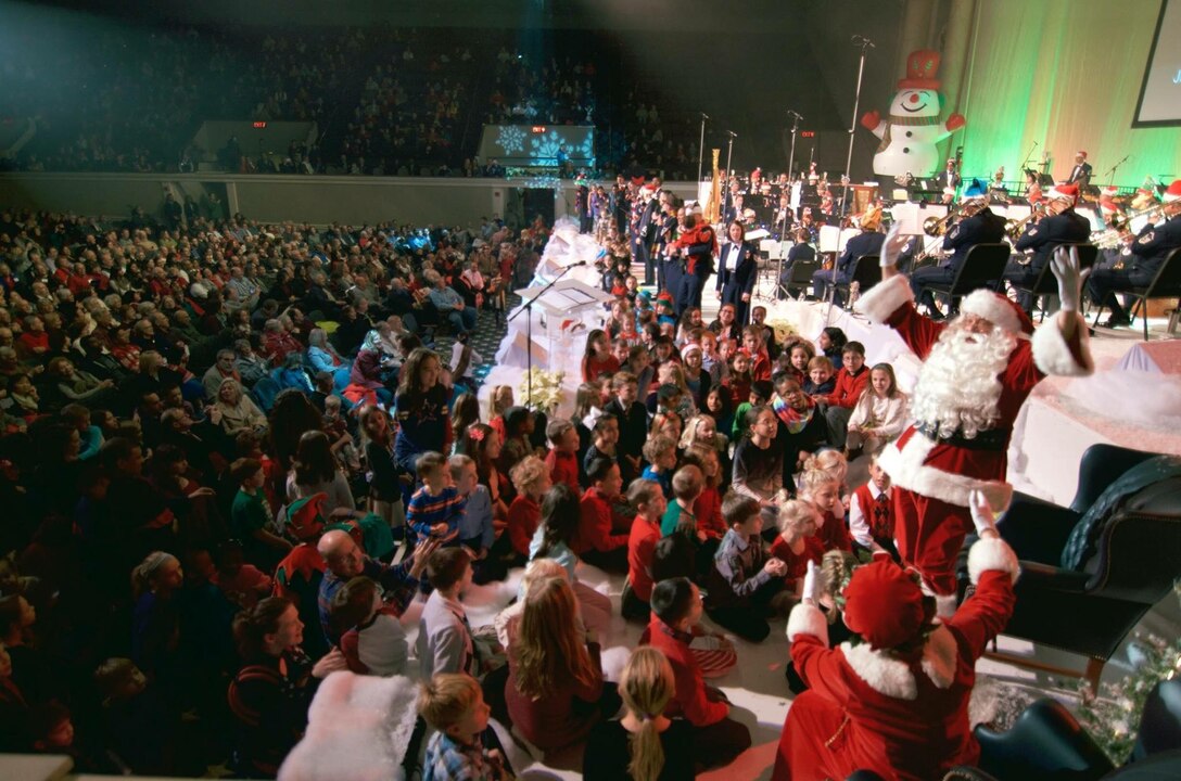 Children from the audience joined Santa on stage for a sing-a-long at the end of the 2016 Spirit of the Season concert at DAR Constitution Hall. (US Air Force Photo by Chief Master Sgt Bob Kamholz/released)