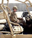 Airman 1st Class Corynn Marcelo sits in one the MRZR military vehicles used by the medical team. Marcelo was deployed to Camp Vance for five-and-a-half months as a medical logistician from Robins Air Force Base, Ga. (Courtesy photo)
