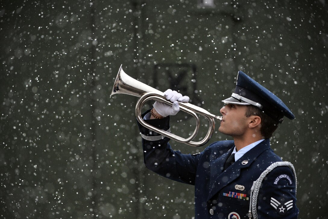 Air Force Airman 1st Class Avery Friedman performs taps during training at Francis S. Gabreski Air National Guard Base in Westhampton Beach, N.Y., Dec. 15, 2016. Friedman is a member of the 106th Rescue Wing Honor Guard. Air National Guard photo by Staff Sgt. Christopher S. Muncy