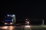 A maintenance crew removes excessive rubber buildup off of an active runway at an undisclosed in Southwest Asia, Dec. 15, 2016. Maintenance crews had roughly 5 minutes to evacuate the runways when aircraft were landing or departing. The strategic operation successfully enabled the 380th Air Expeditionary Wing to maintain its current level of support in Combined Joint Task Force-Operation Inherent Resolve. (U.S. Air Force photo/Senior Airman Tyler Woodward)