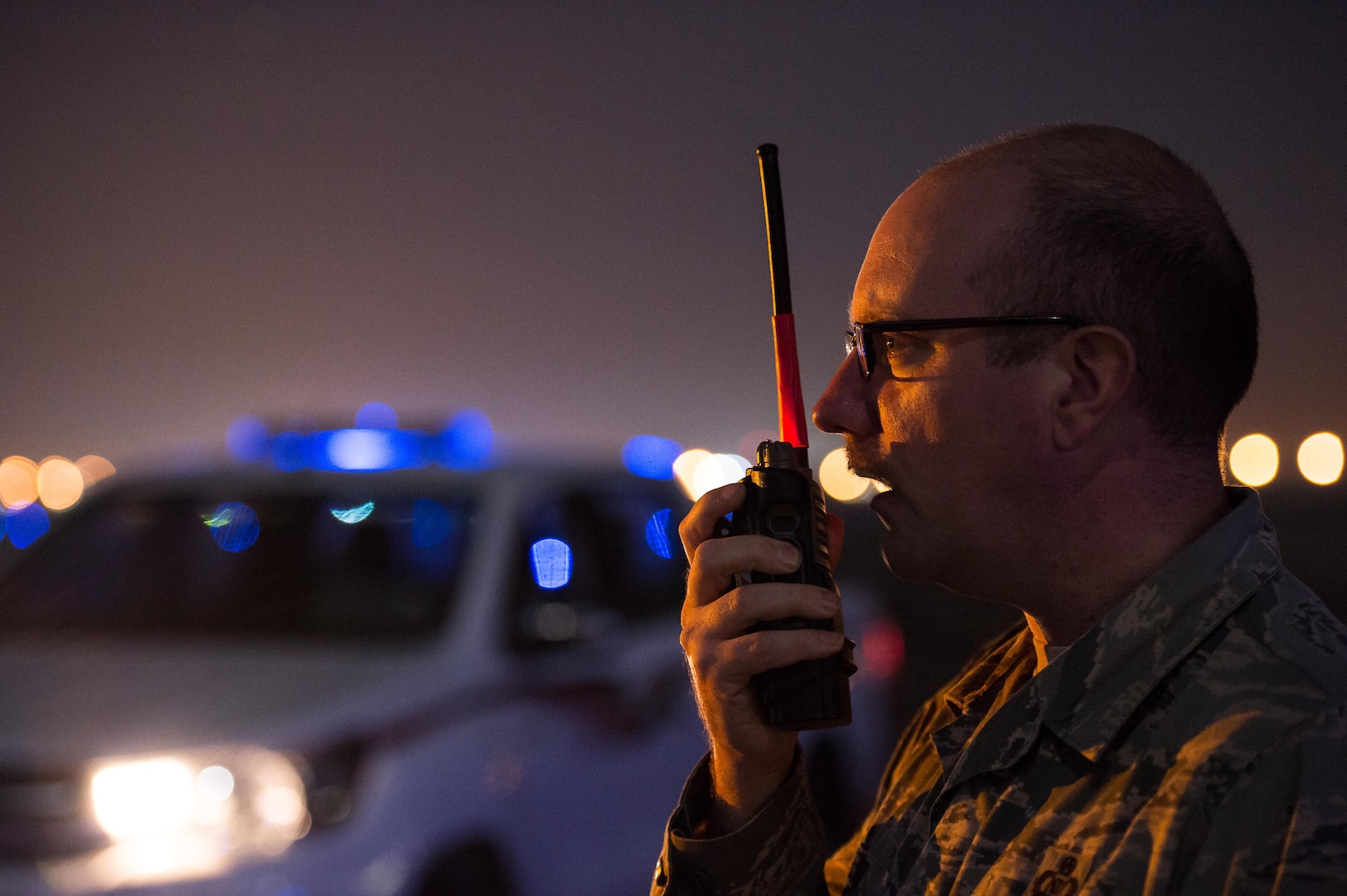 Master Sgt. Christopher, 380th Expeditionary Operations Support Squadron airfield manager, communicates with an air traffic control tower during a maintenance project on an airfield at an undisclosed location in Southwest Asia, Dec. 15, 2016. (U.S. Air Force photo/Senior Airman Tyler Woodward)